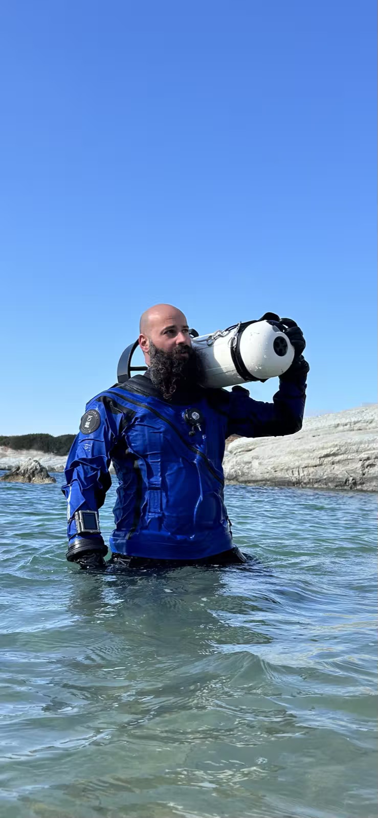 Imad Farhat GUE instructor portrait with SUEX DPV scooter on Cyprus beach